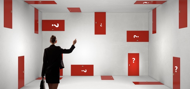Businesswoman in room choosing one of plenty of doors